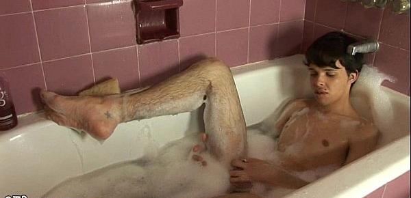  Nude boy having fun stroking off in a bubble bath